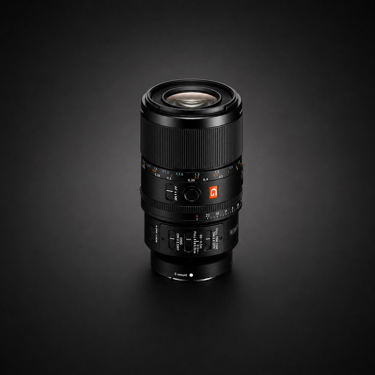 Sony 100mm f2.8 macro G Master lens on a black background