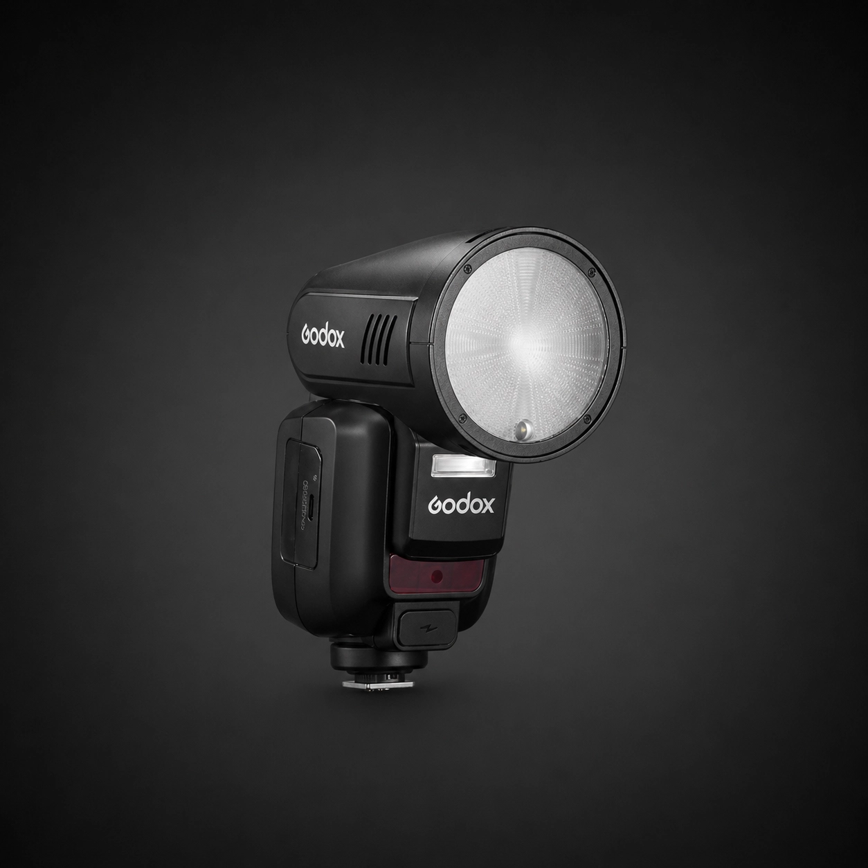 Godox V100S camera flash on a black background